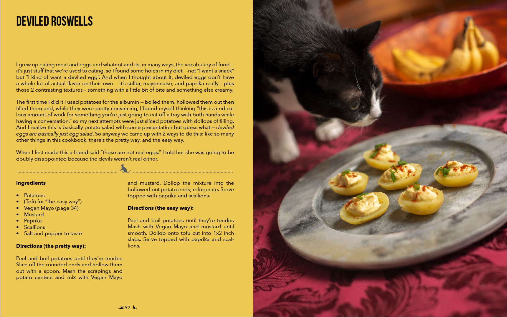 Photograph of a
        tuxedo cat sniffing vegan deviled eggs